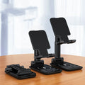 Cool Black desktop mobile phone stand and wireless charger on a wooden desk
