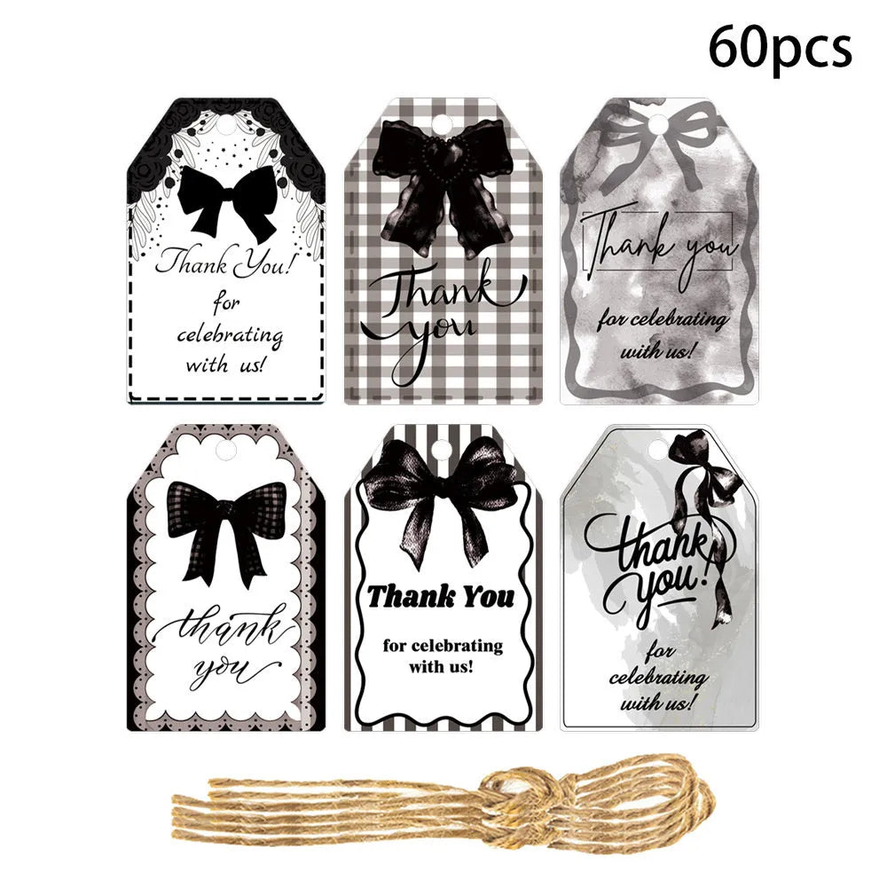 Three styles of creative bowknot paper gift tags with natural hemp rope for party decorations