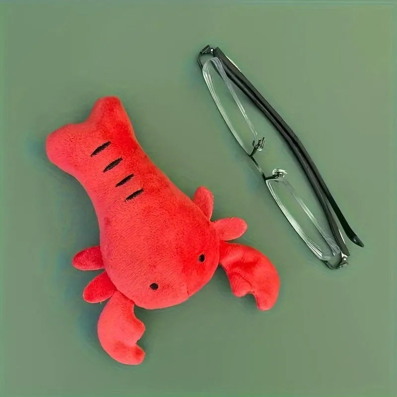 Red lobster-shaped squeaky dog toy for small and medium breeds on white background