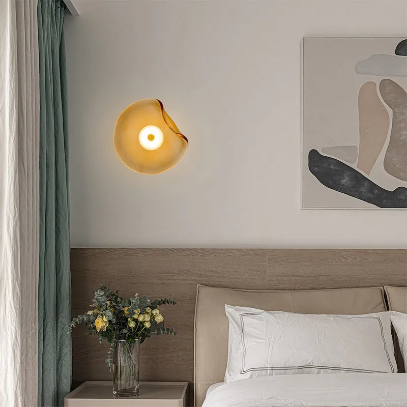 Round decorative wall lamp with glass shade for bedroom bedside lighting