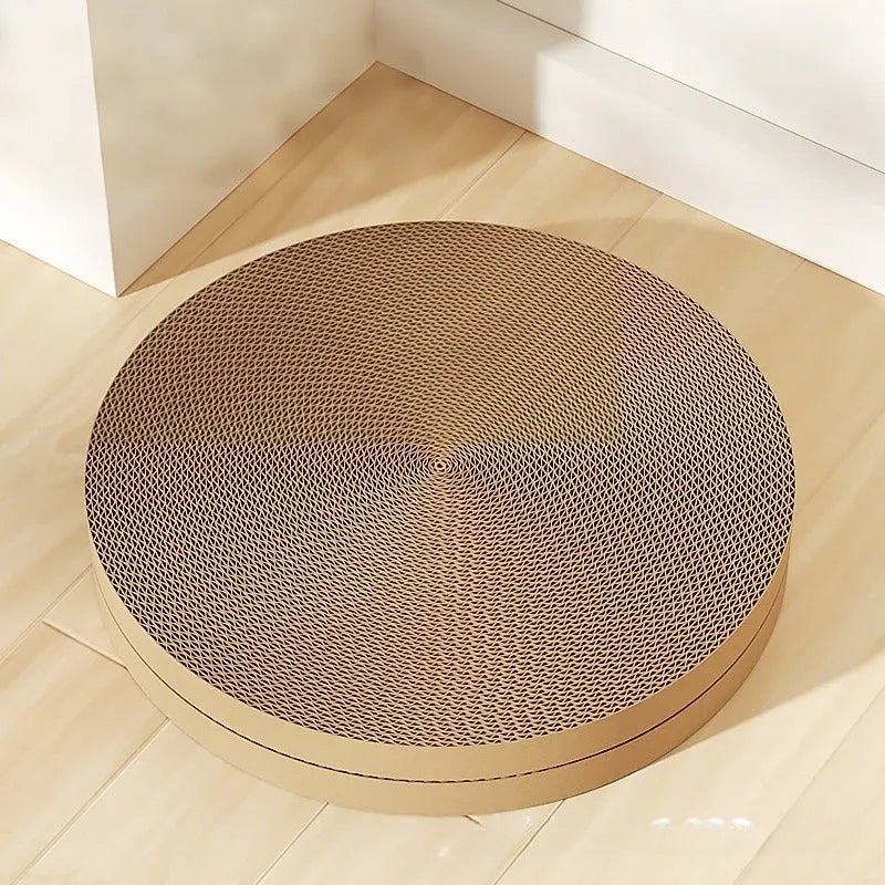 Green and white round cat scratching board with corrugated paper centre measuring 55 cm diameter