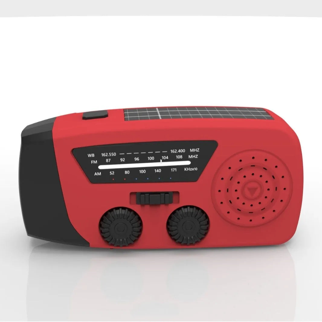 Red rechargeable emergency hand radio with LED torch, built-in speaker, and wrist strap for disaster preparedness
