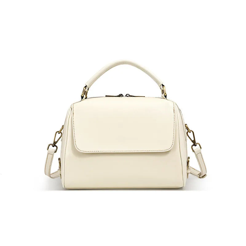 Women's soft genuine leather crossbody tote bag in a square shape with a double strap, shown in apricot colour.