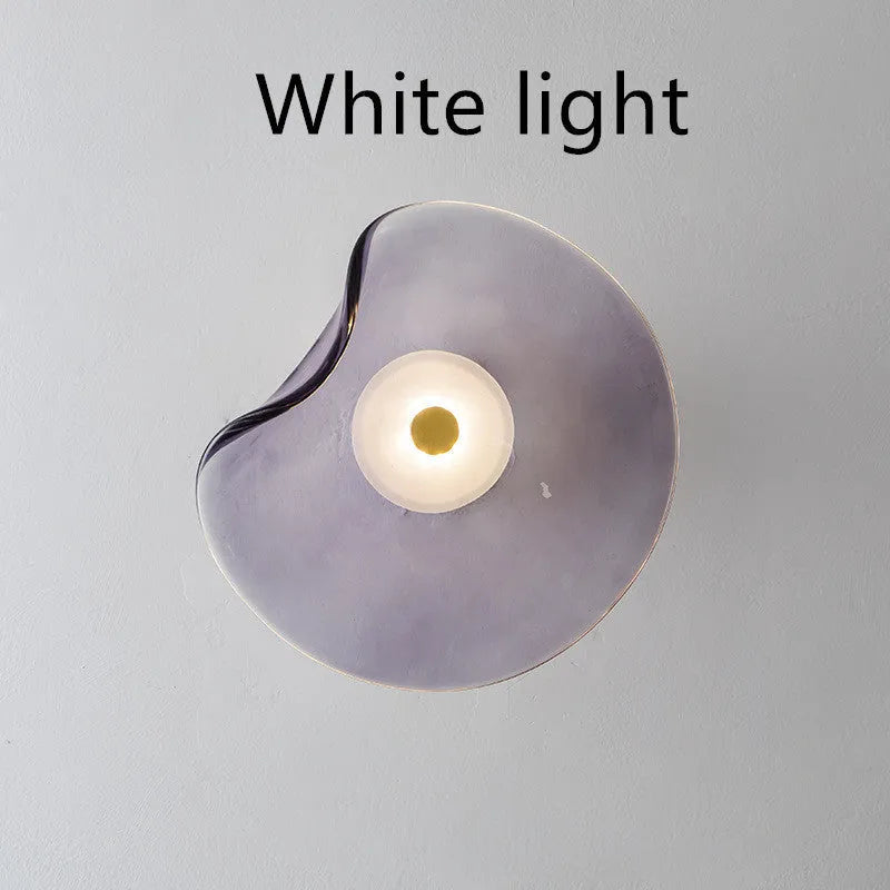 Round decorative wall lamp with glass shade for bedroom bedside lighting