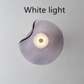 Round decorative wall lamp with glass shade for bedroom bedside lighting