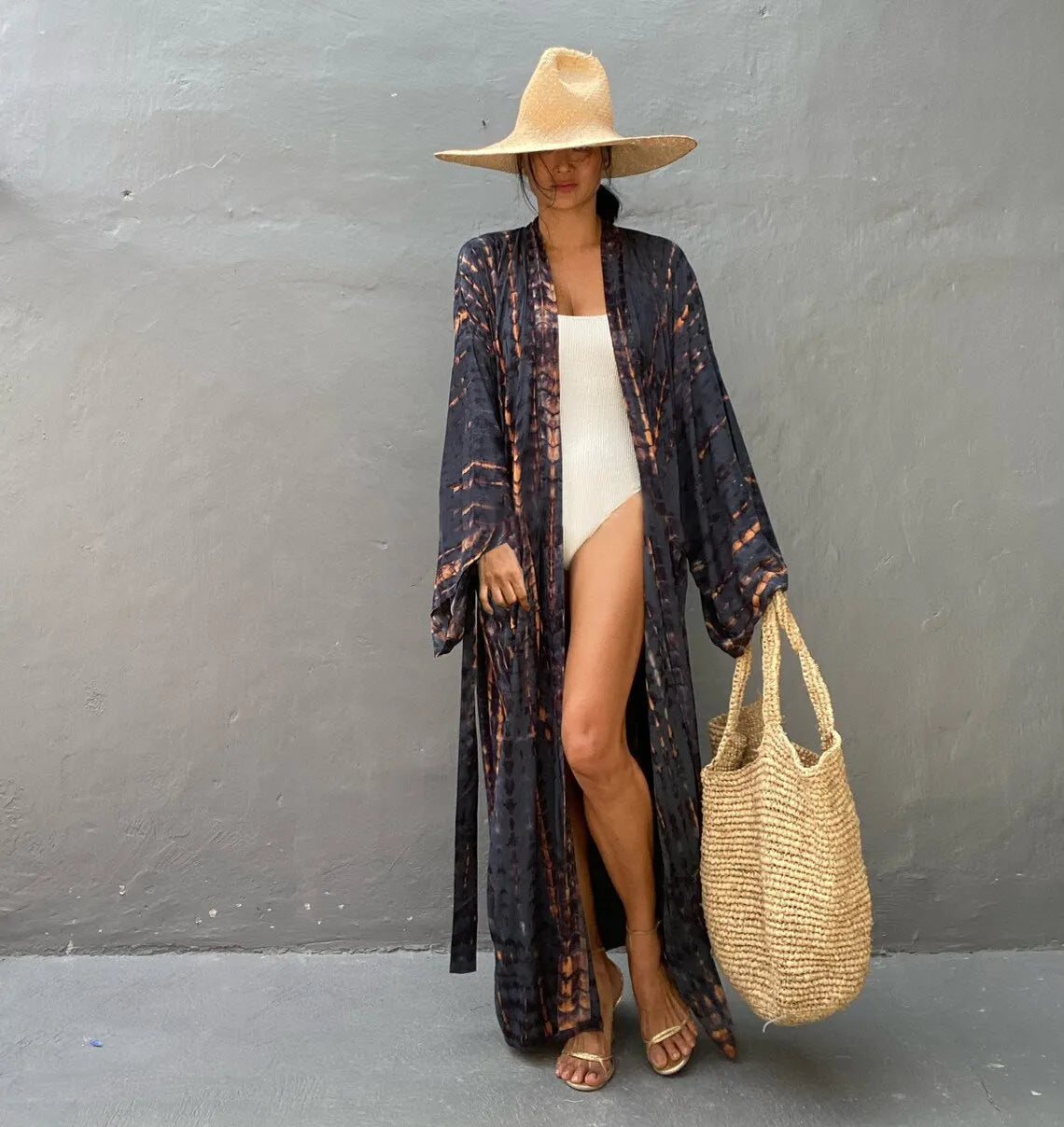 Woman wearing a printed cotton beach cover-up blouse in a DN0712 series colour.