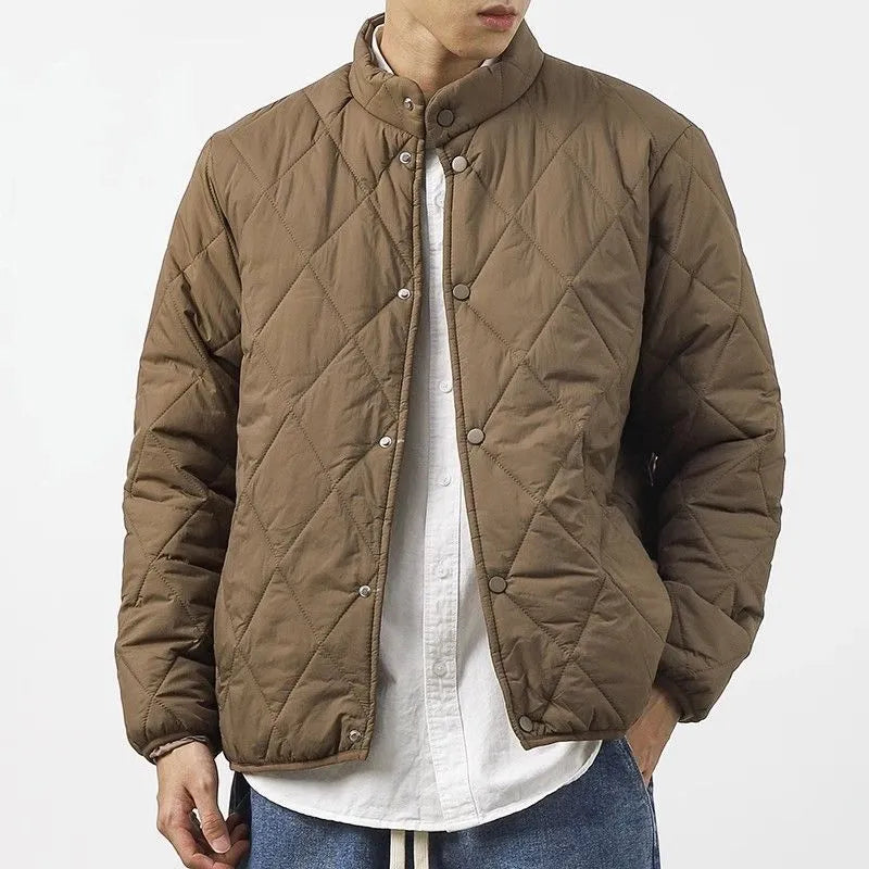 Men's black diamond pattern cotton-padded jacket with elongated length and loose urban style