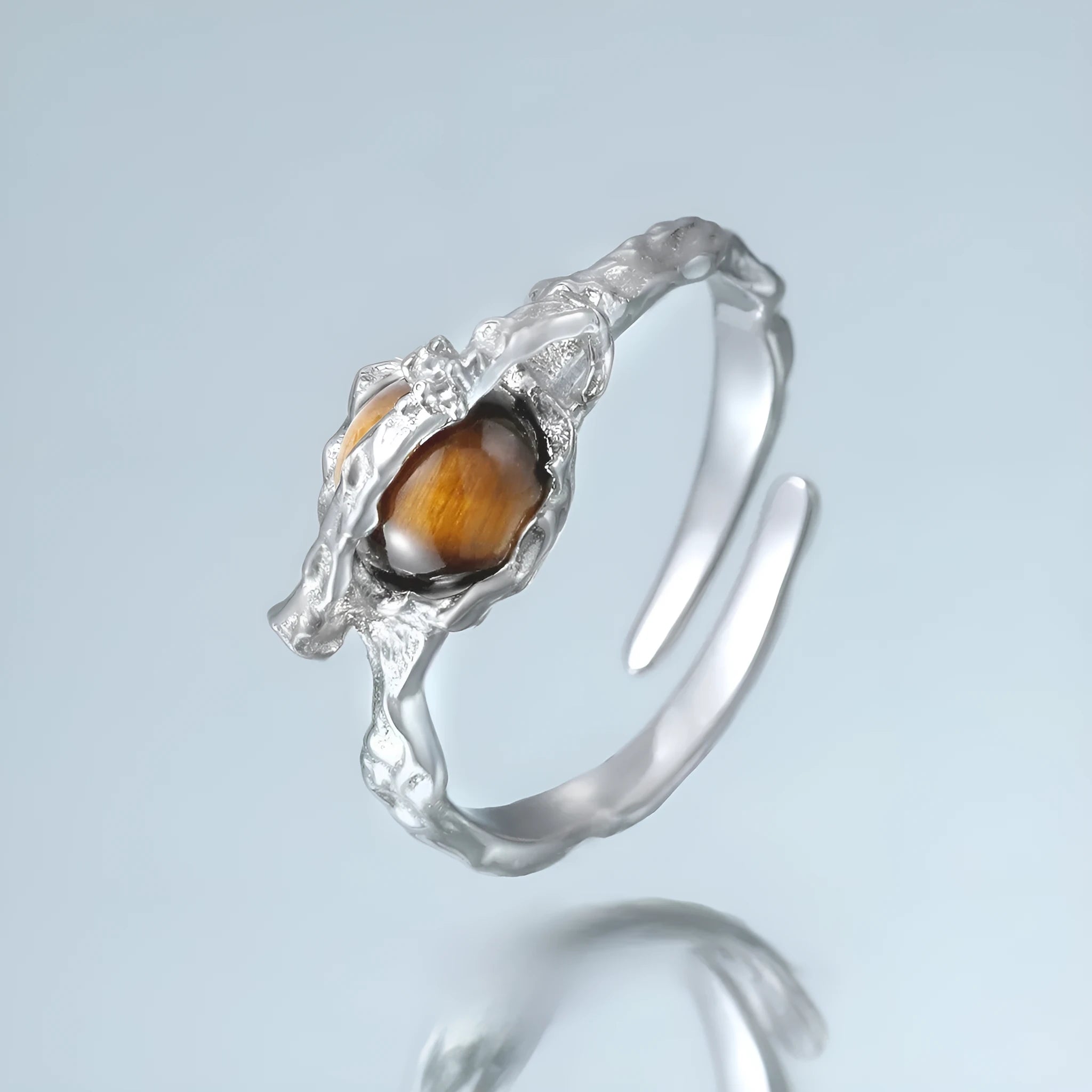White gold colour Saturn Tigereye open adjustable ring for women on display