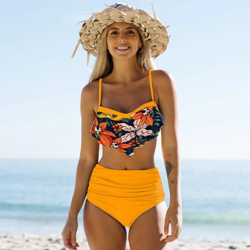 Women's high-waisted split bikini swimsuit with floral pattern in blue or green colour options
