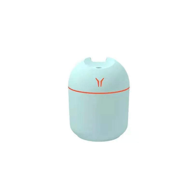 Mini round desktop and car humidifier with USB cable in ivory white, sky blue, or pink.
