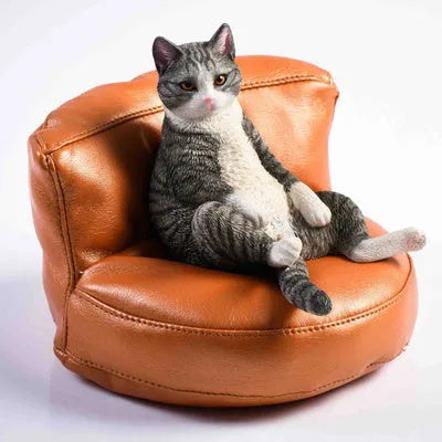 Lazy cat car ornament figure with sofa accessory on dashboard
