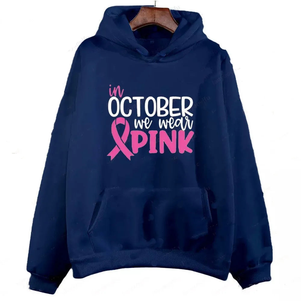 Retro graphic 'I'm A Survivor' slogan pullover hoodie with side seam pockets in pink colour.