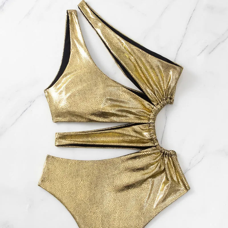Women's one-piece swimsuit in gold colour with backless design and sleeveless cut