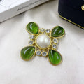 Close-up of a vintage zinc alloy baroque cross brooch with crystals, showing one of eight available colour styles.