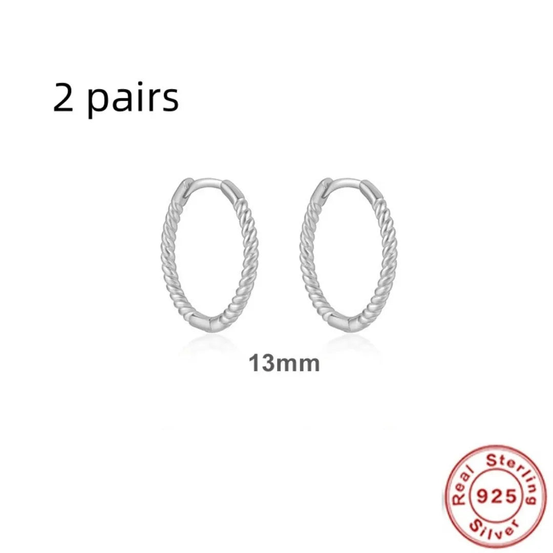 Sterling silver twisted ring earrings in geometric round design with gold or platinum finish