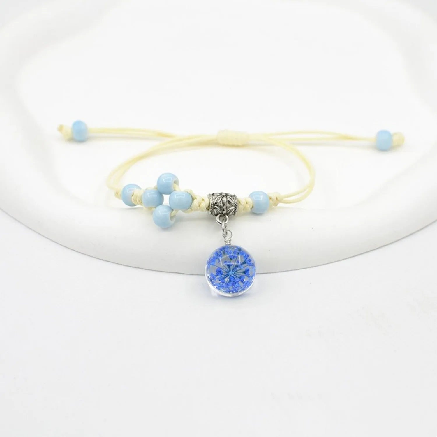 Glass dried flower bracelet with large 1.4cm beads containing real preserved flowers in hand-woven design