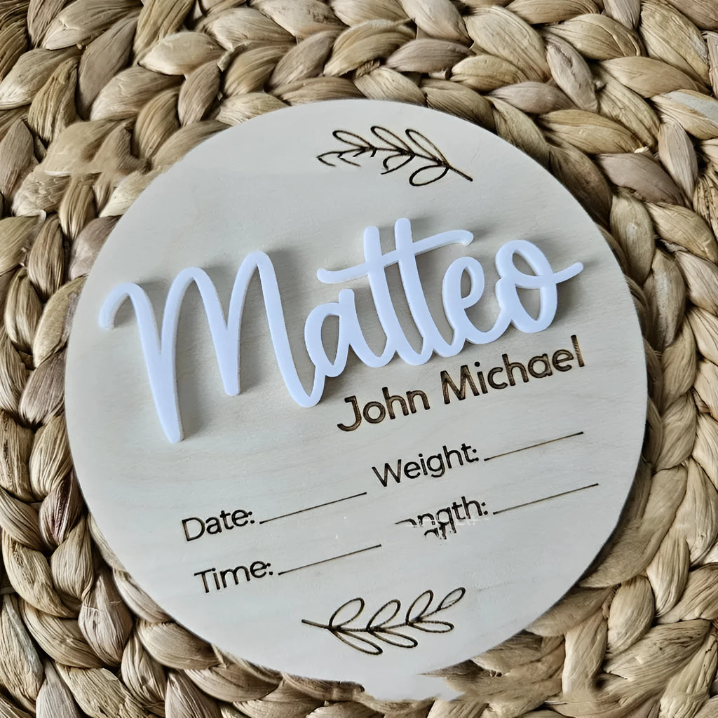 Square 15cm wooden baby name plaque with birth details displayed, shown in three style options.