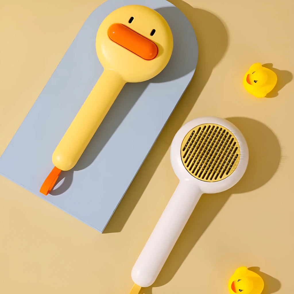 Small yellow plastic comb with needle bristles for pet hair removal on cats and dogs.