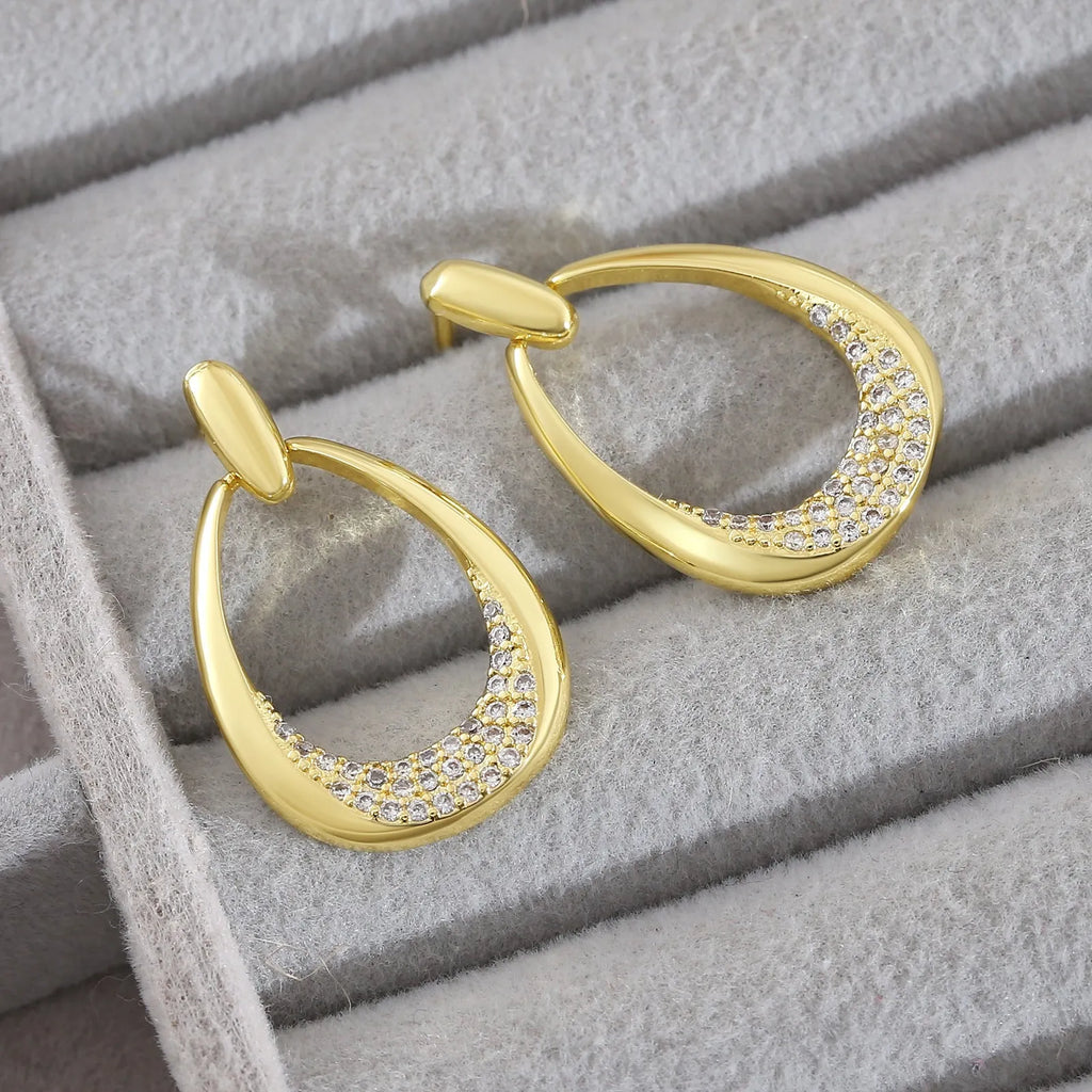 Women's yellow gold geometric drop earrings with copper electroplated finish measuring 2.6cm by 1.7cm