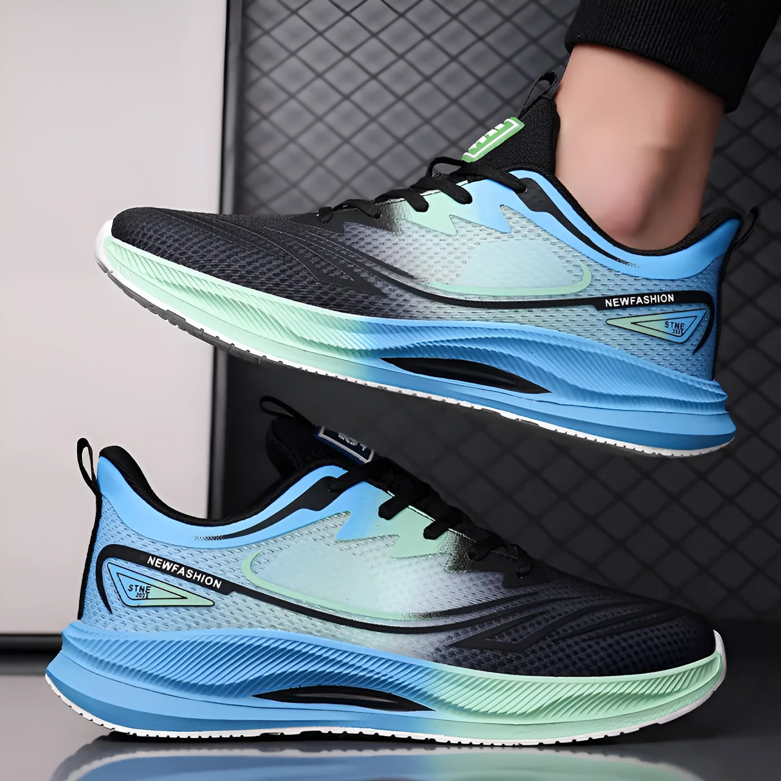 Men's black and blue fly woven mesh casual sneakers with a round toe and low platform sole.