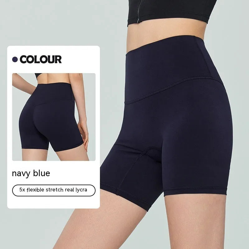 Women's high waist Lycra yoga shorts in leaf green, shown in a yoga pose.