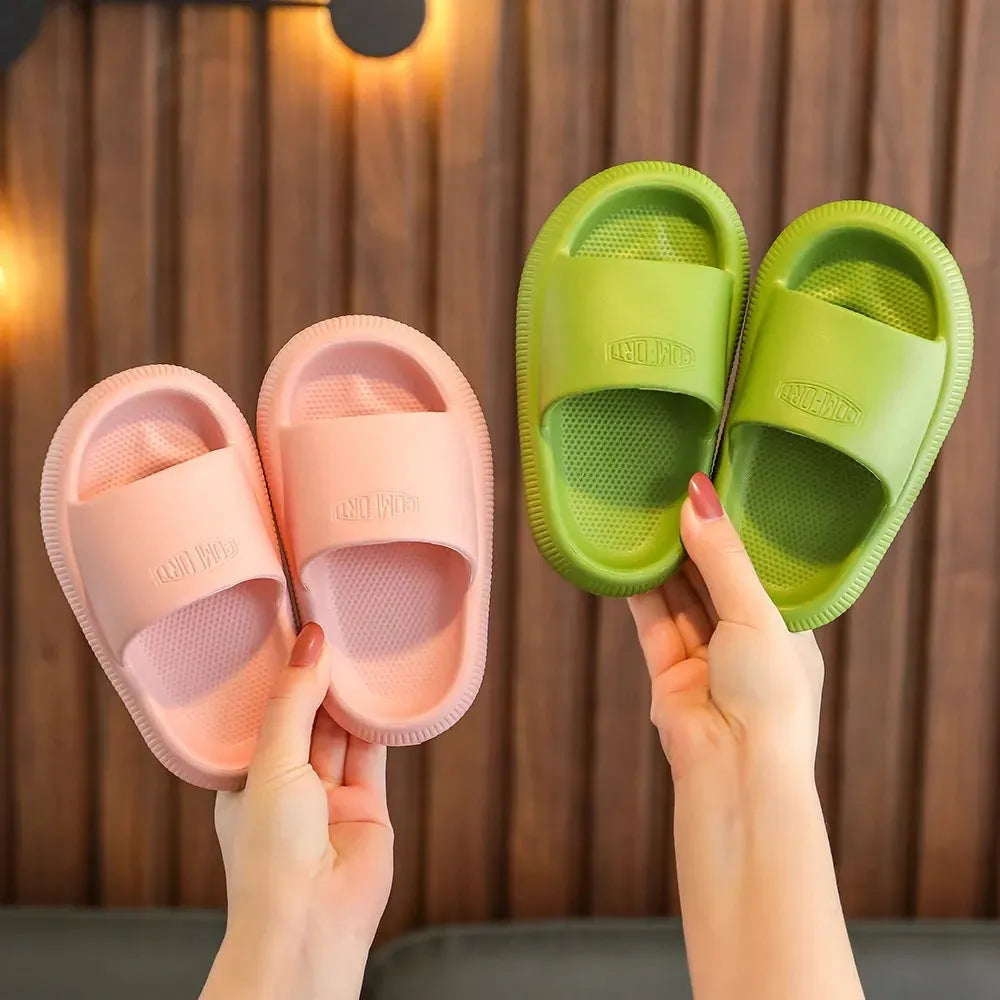 Children's brightly coloured EVA slippers with a thick, non-slip sole.
