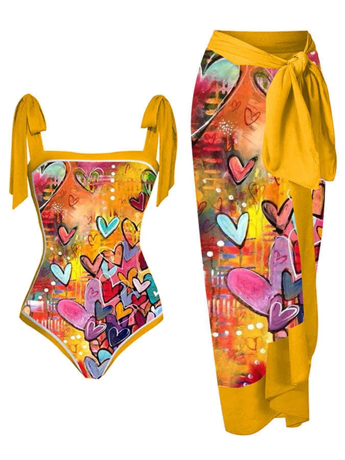 Women's printed floral two-piece swimsuit with a matching chiffon hip skirt.