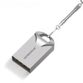 Compact black and silver metal USB flash drive on a white background showing its small size.