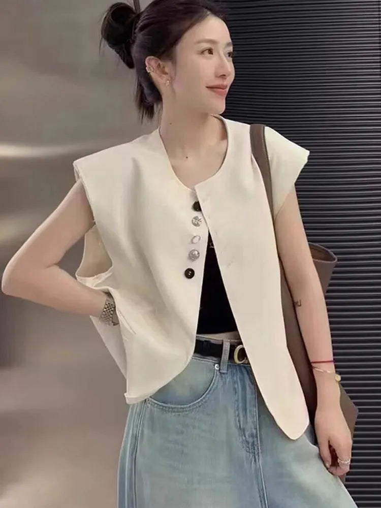 Women's loose fit polyester vest in milky white with pocket detail and 40cm length