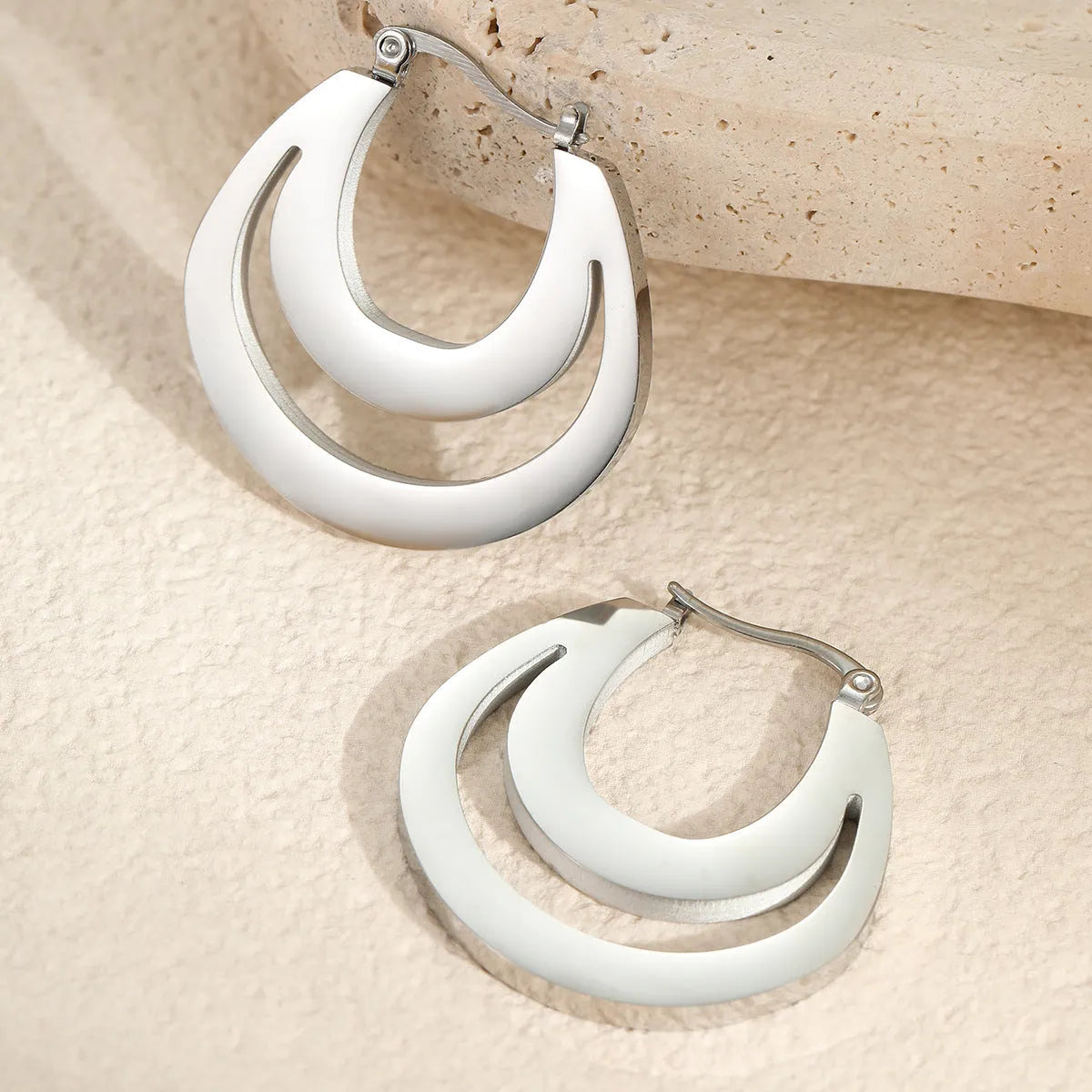 Pair of 18K gold plated geometric stainless steel French earrings with round ring minimalist design for women