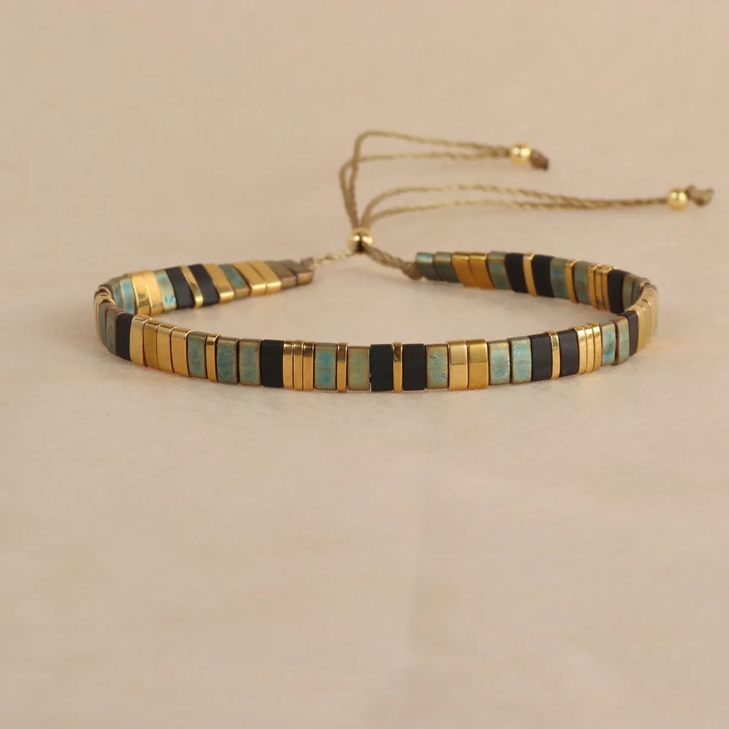 Geometric glass and coloured glaze bead bracelet in milky white, black, green, blue, or red
