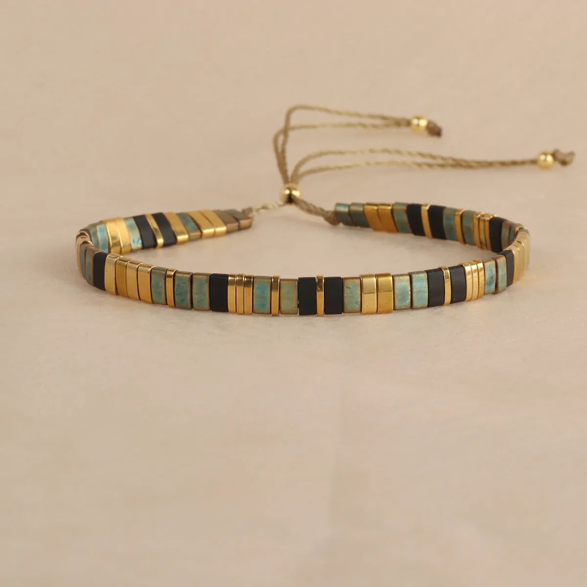 Geometric glass and coloured glaze bead bracelet in milky white, black, green, blue, or red