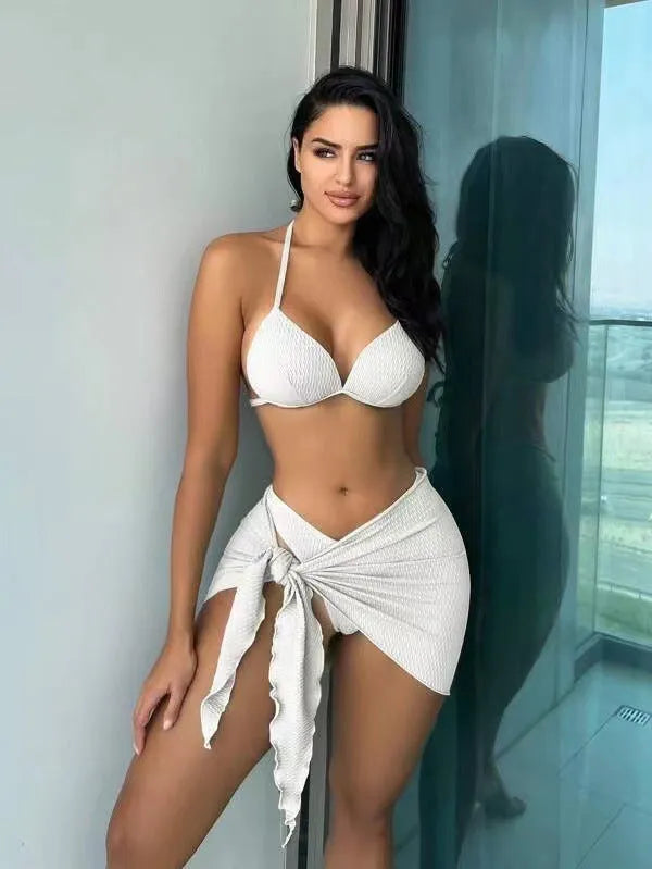 Women's sexy Russian split three-piece swimsuit set in a solid colour, shown with top, skirt, and panties.