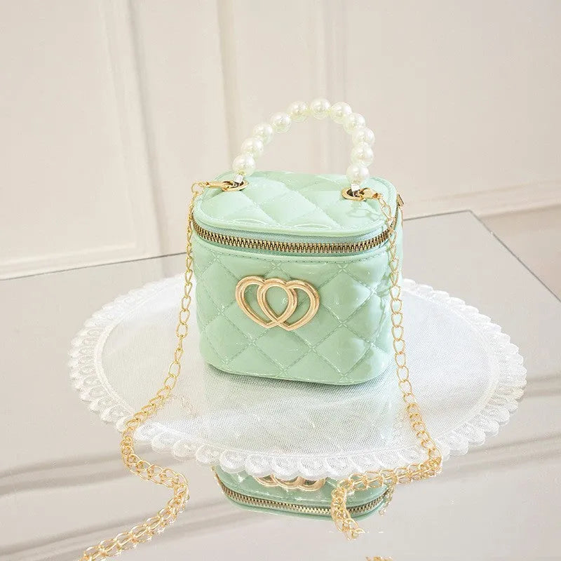White PVC bucket-shaped gel bag with a heart pattern visible inside the open top.