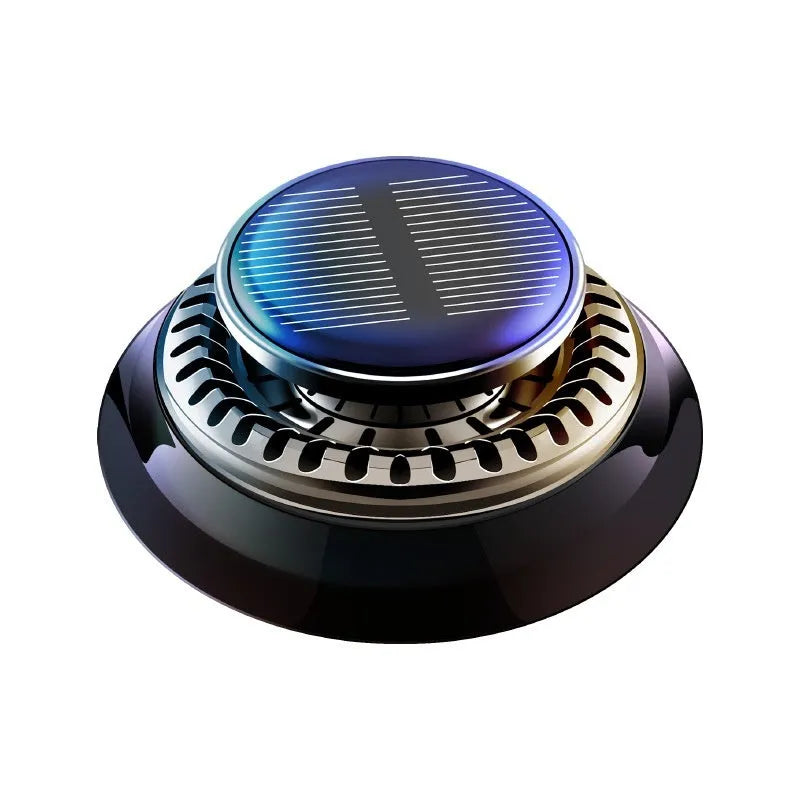 Solar powered kinetic car air freshener with rotating double rings on vehicle dashboard