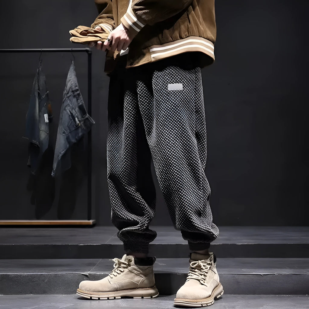 Grey men's straight leg sweatpants with an ankle strap tie detail