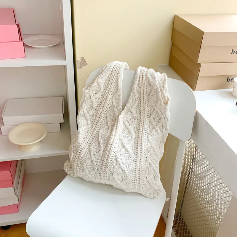 Retro style hollow knitted women's tote bag in a solid colour with double shoulder straps
