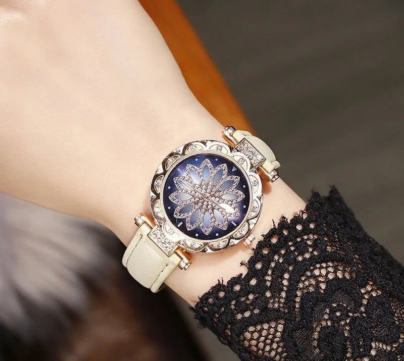 Women's fashion watch with diamond bezel, round 32mm dial, available in multiple colours on a pin buckle strap.