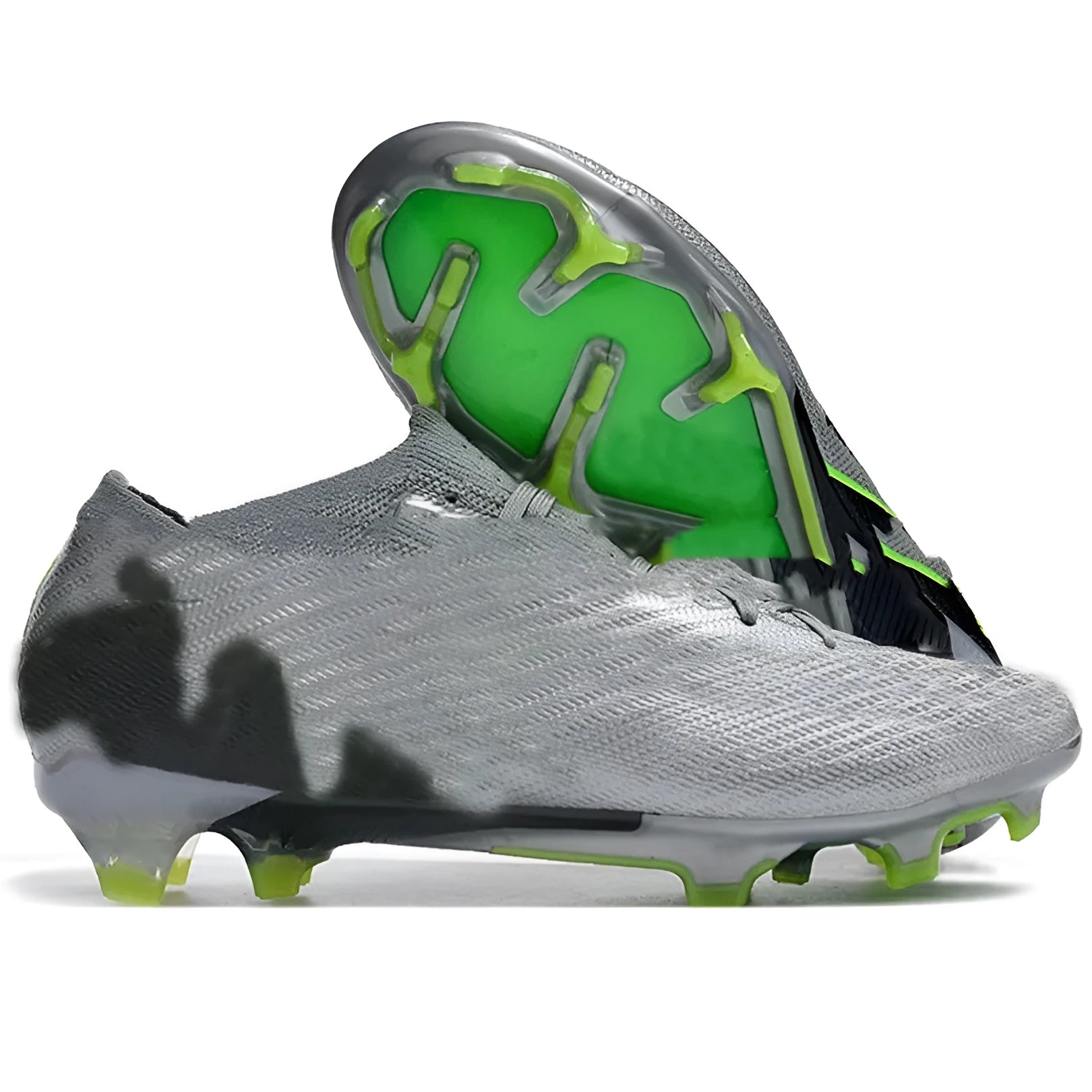 Men's low-top football shoes with knitted upper, rubber FG studs, and front lace-up closure.