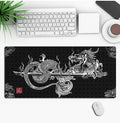 Hot anime series gaming mouse pad with colourful graphic, shown on a desk with a mouse.