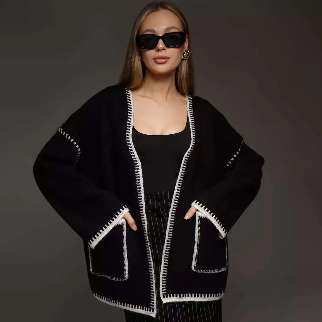 Lace-up front knitted cardigan in camel colour showing loose mid-length design and long sleeves