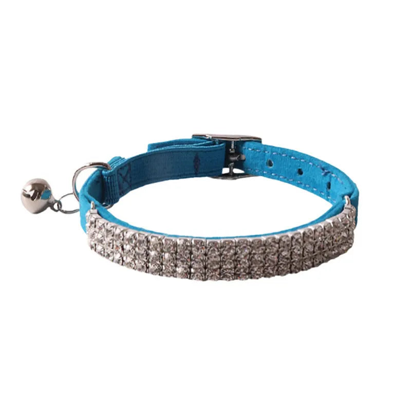 Colourful flocked cat collar with elastic buckle in pink, black, red, blue, purple, and dark brown options.