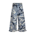 Snow camouflage pattern on blue loose-fit denim jeans with a mid waist.