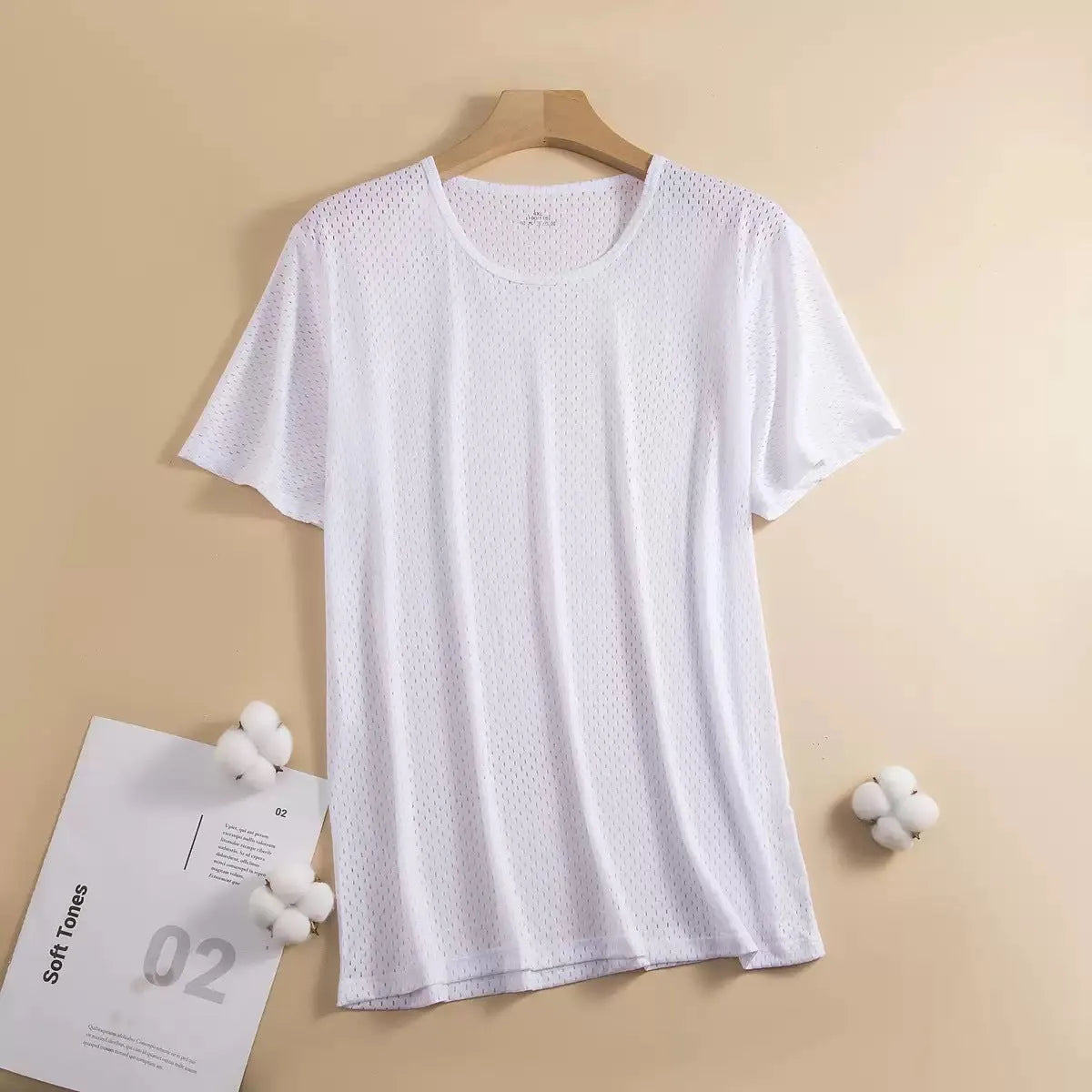 Man wearing a thin grey ice silk mesh short sleeve T-shirt with a crew neck.