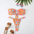 Women's floral printed tube top bikini swimsuit with brief backless design on mannequin