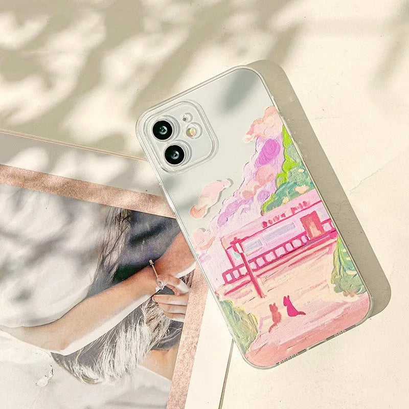 Soft silicone mobile phone case for iPhone featuring a colourful two-cat cartoon design on the back.