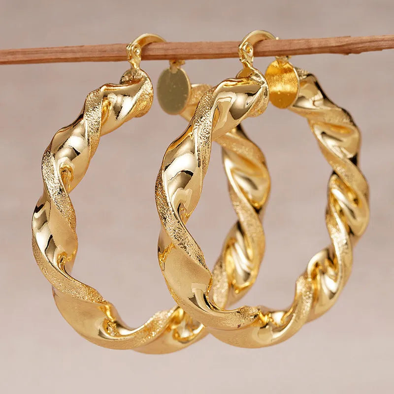 Women's geometric ring design ear clip earrings with drop-shaped elements and electroplated copper construction