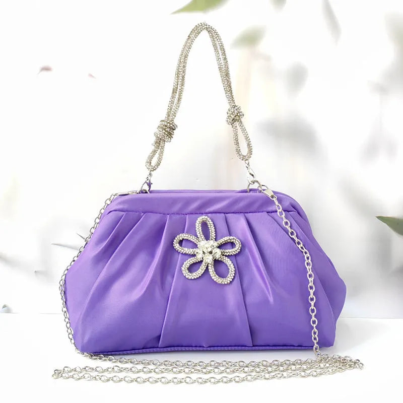 Women's soft polyester crossbody bag in shell shape with chain decoration and internal document organiser