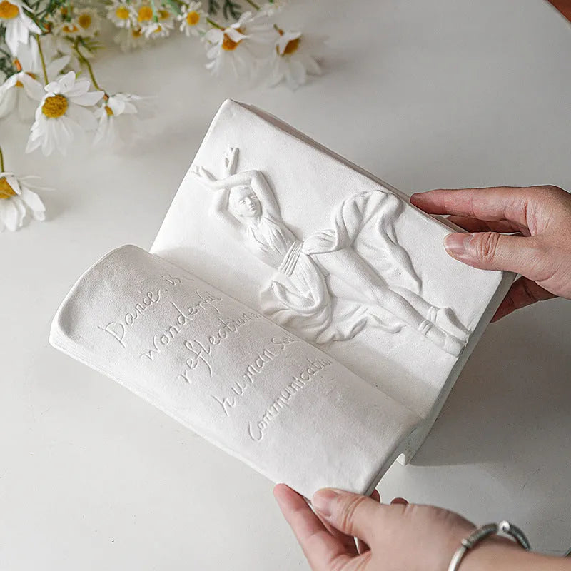 Glazed ceramic book stand ornament in a modern style on a desktop, shown in one of four design options.