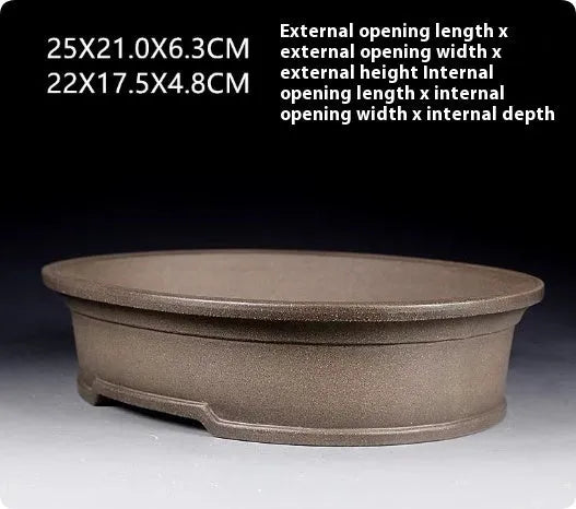 Handmade purple sand clay bonsai pot with antique oval design measuring 25x21x6.3cm